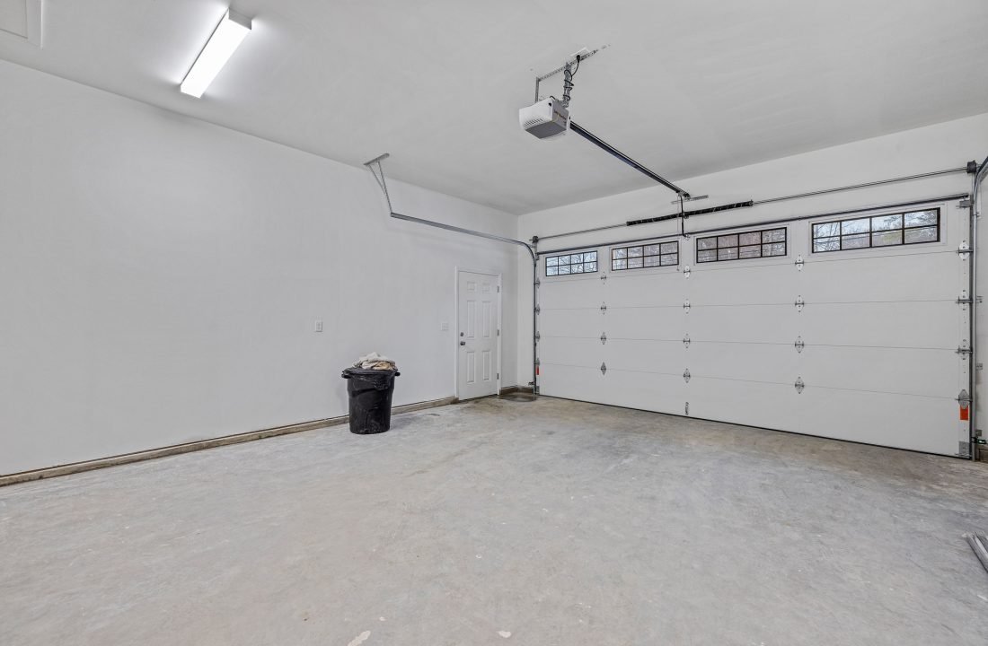 Empty white garage with windows